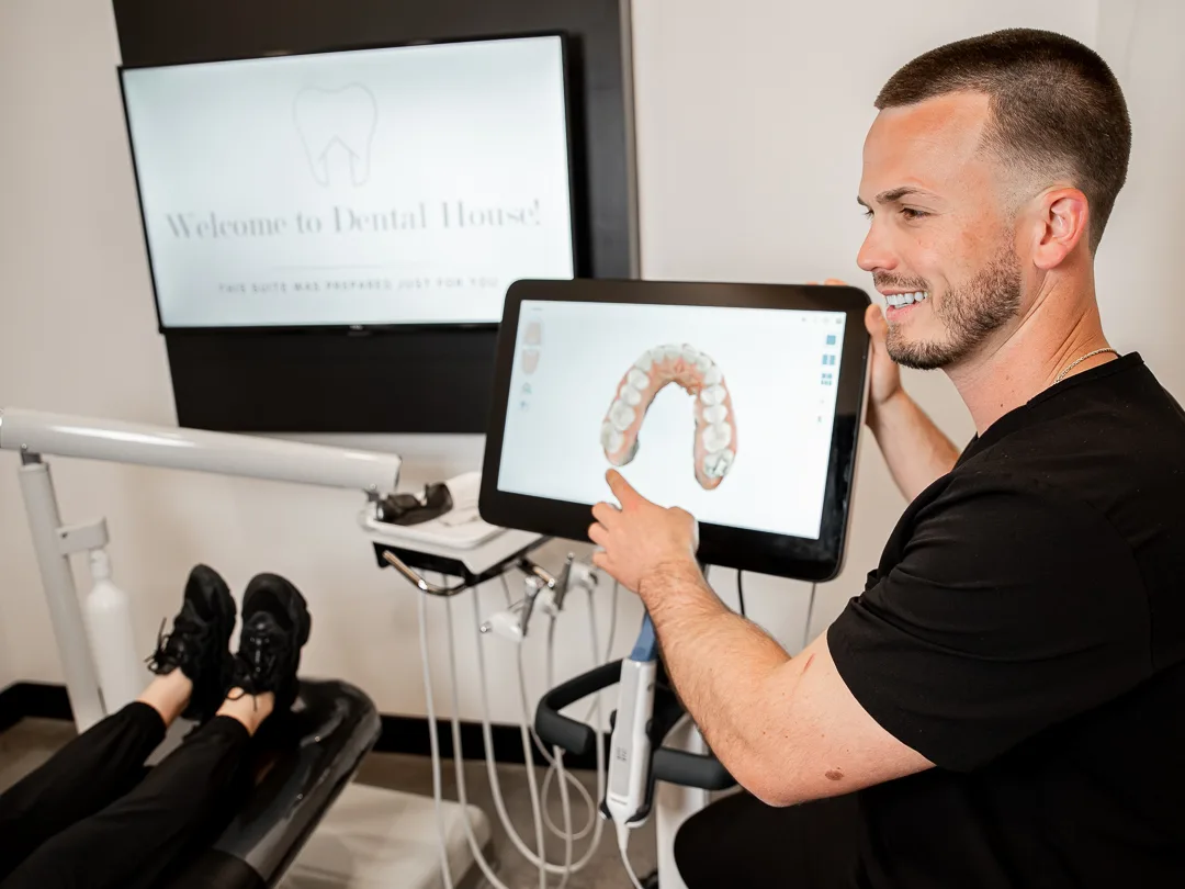 Dr. Kye reviewing a digital scan with a patient